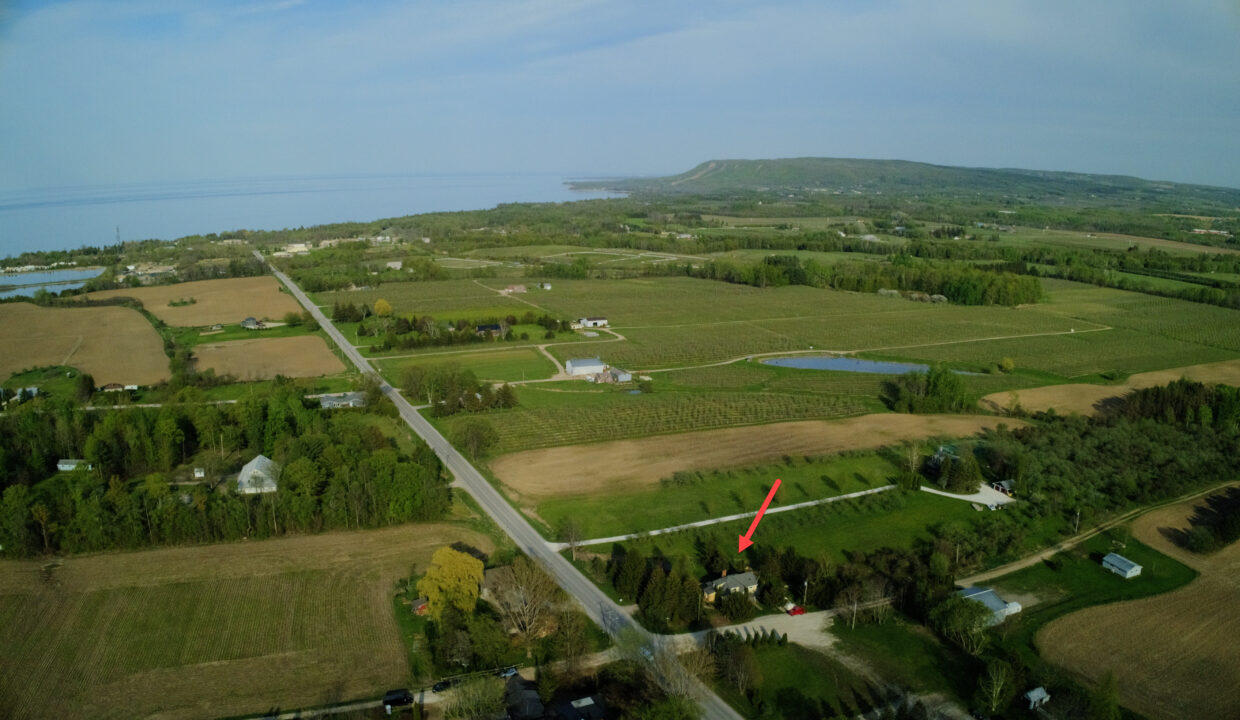 228 Clark from across the road towards escarpment - arrow