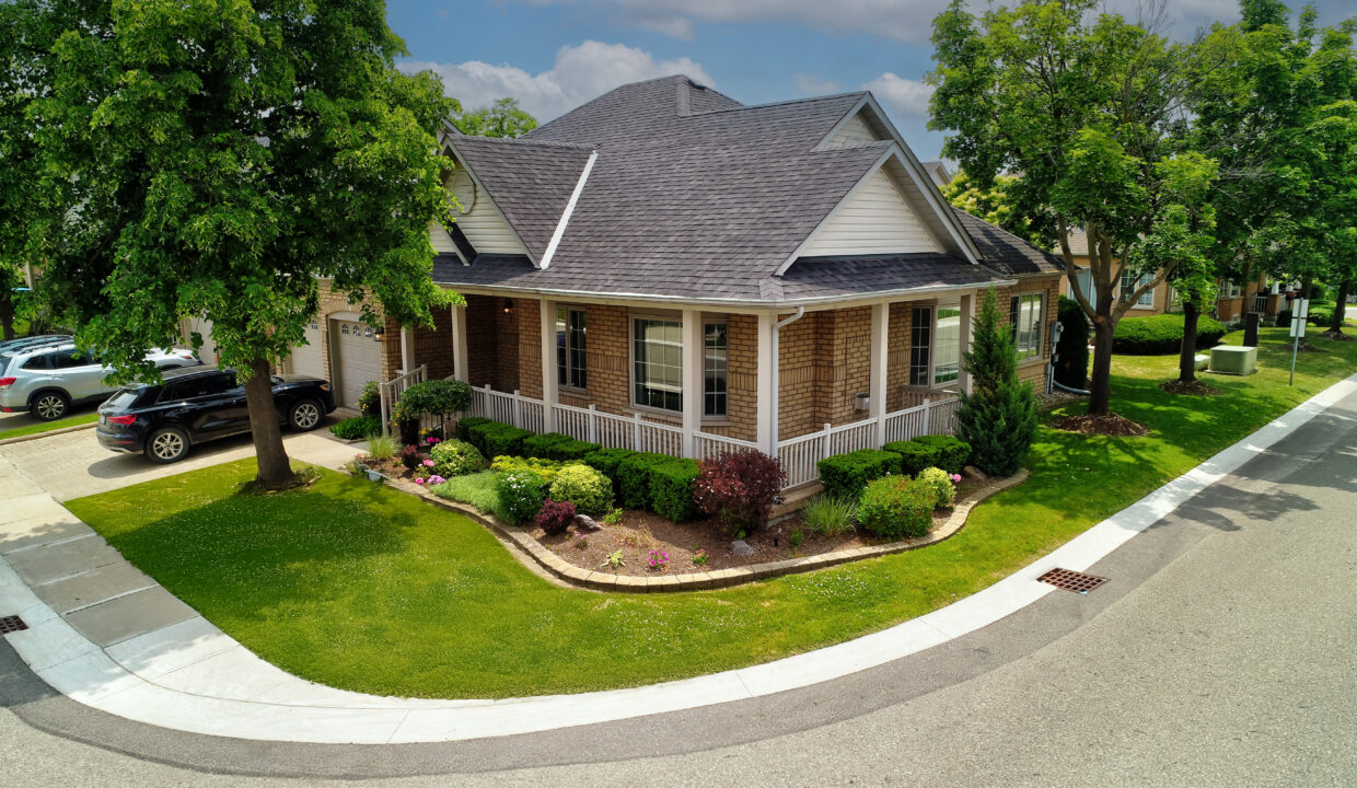 A. Front Porch Aerial - road fixed, sky blue and green grass