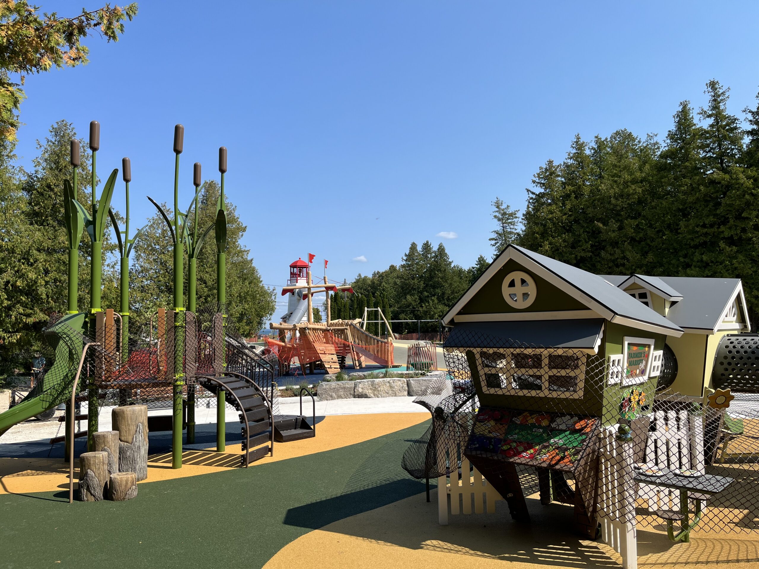 Wide view of the lighthouse-themed playground at Sunset Point Park in Collingwood