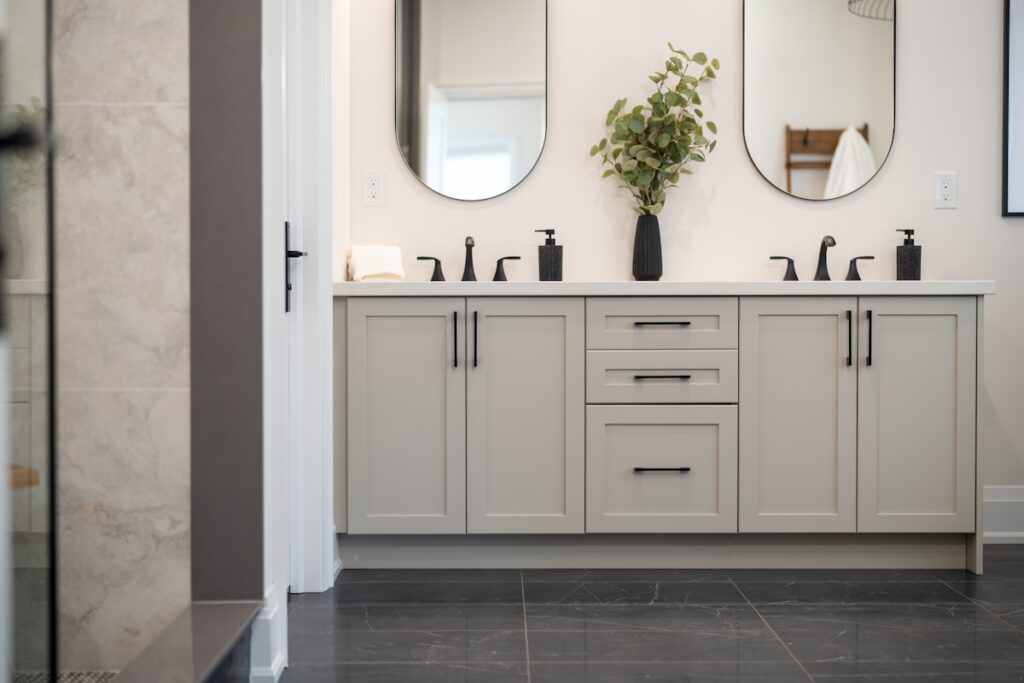 Bright modern bathroom with double vanity and mirrors