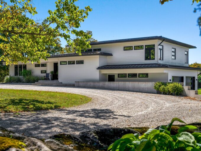 Front corner of the house from the curving gravel driveway