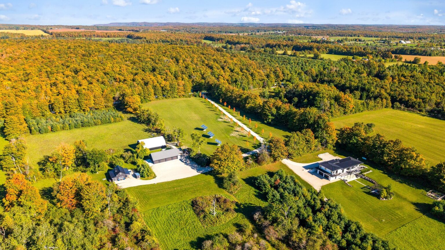 Aerial view of the main house, pavilion, cabin and Coverall barn