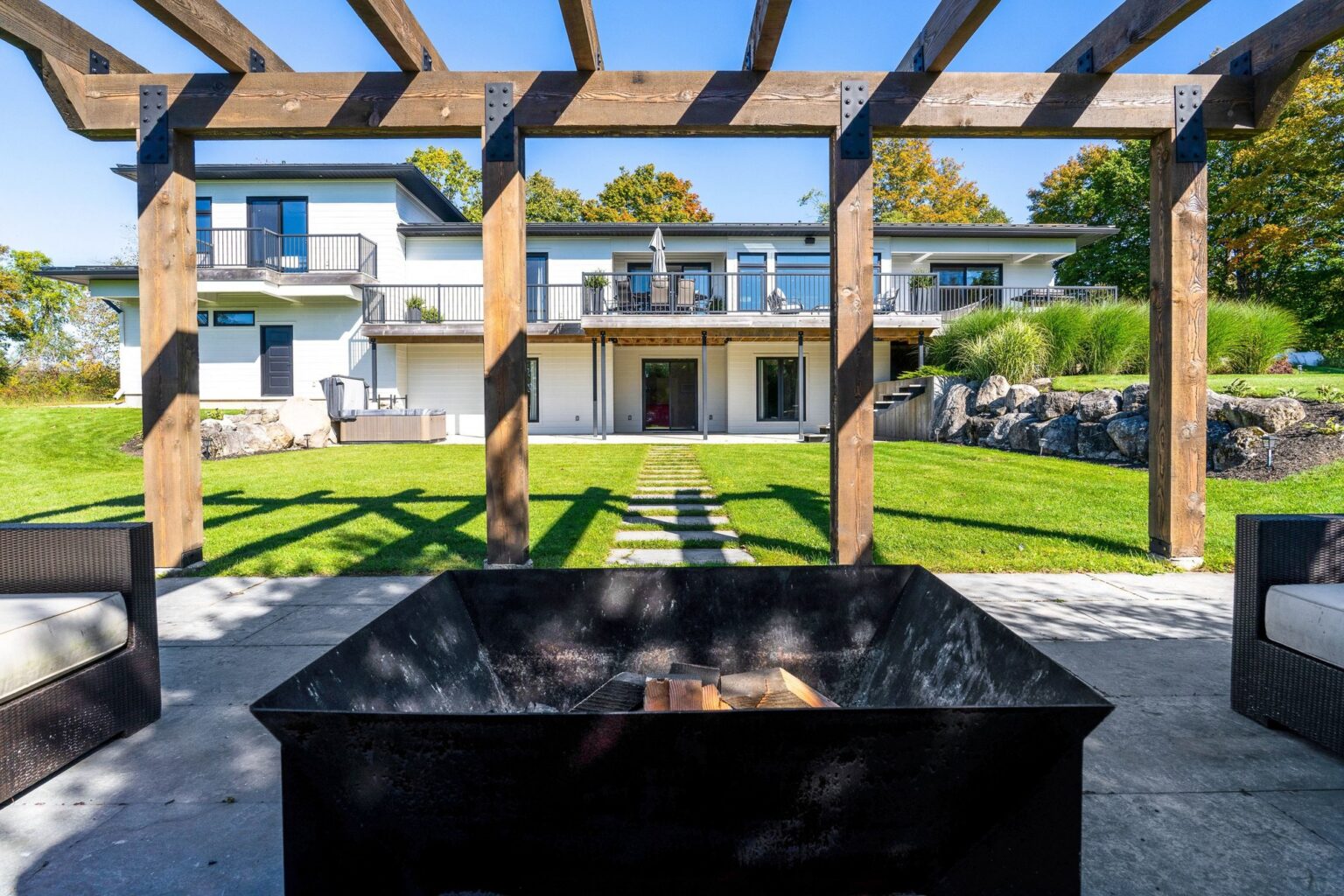 View back to the house from the timber pergola and fire pit